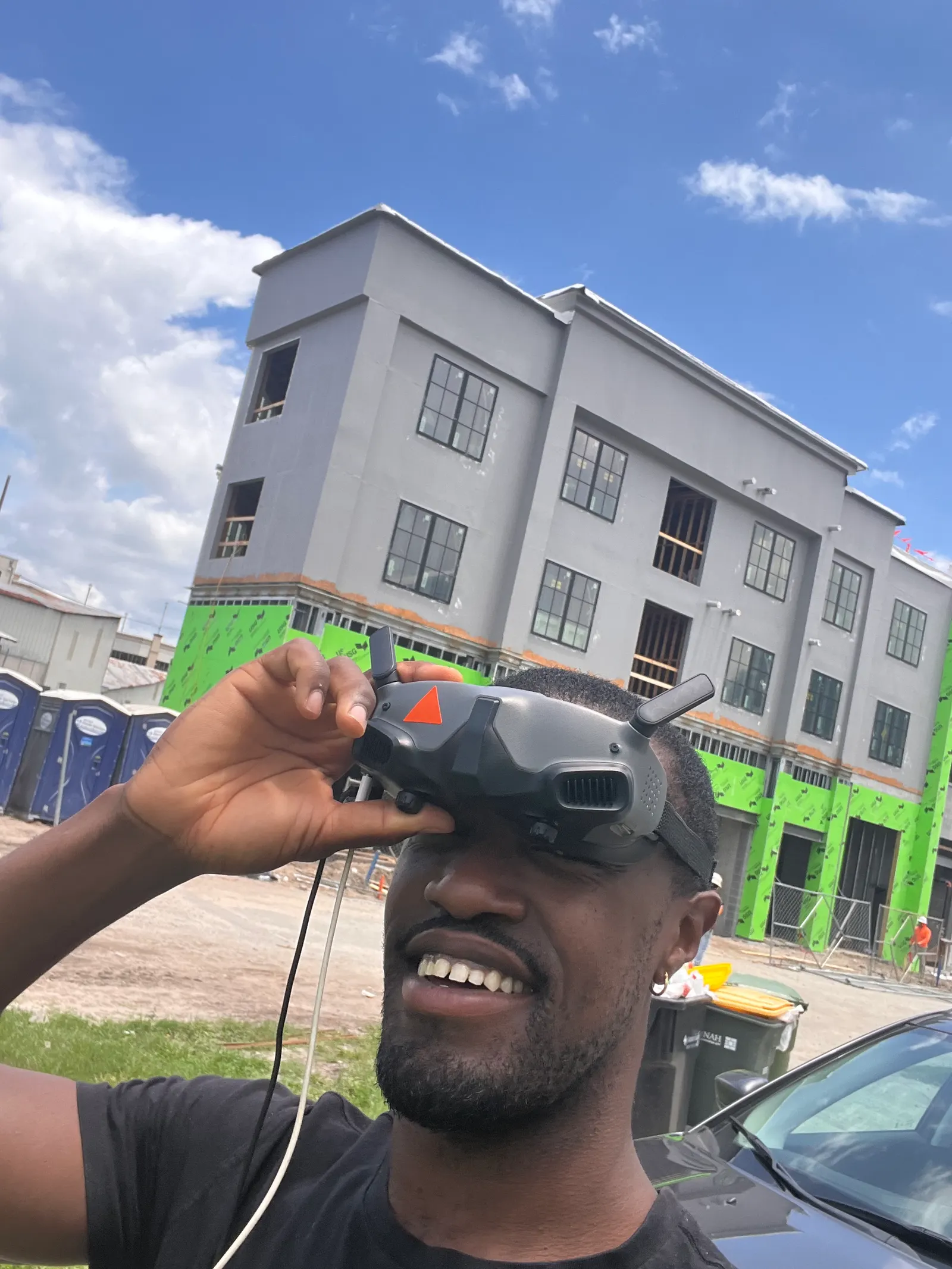 Denzel selfie wearing FPV goggles — Under One Sun aerial imagery
