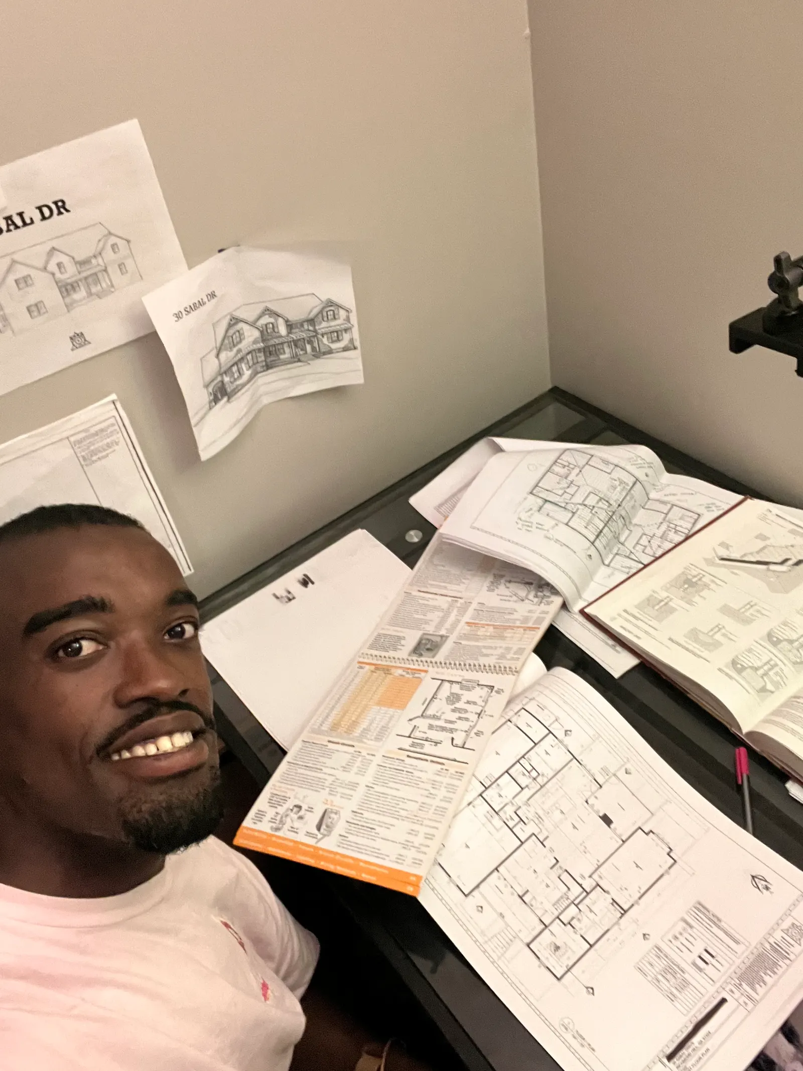 Denzel with residential design sketches — Under One Sun residential design